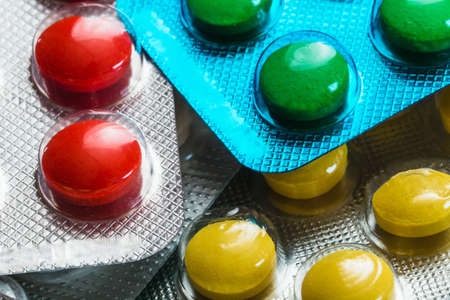 different colored pills in the pack closeup