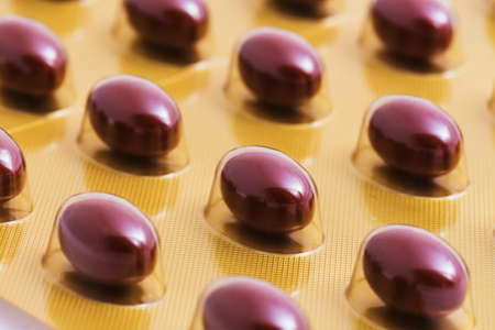 the color pill or just salmon oil capsulesの写真素材