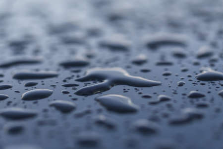 Drops of water on a glossy surfaceの写真素材