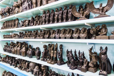 Showcase in the shop with Egyptian souvenirs and statuesの写真素材