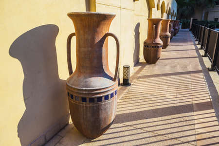 Eastern pitchers stand on a shelfの写真素材