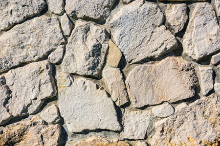 Old stone brick wall fragment の写真素材