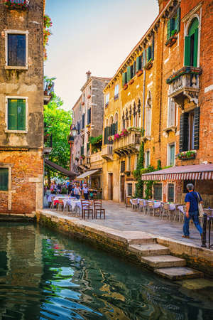 VENICE-JUNE, 26, 2014: Narrow canal among old colorful brick houses in Venice, Italy.のeditorial素材