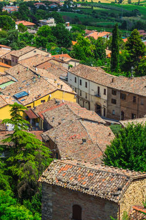 agricultural landscape with old village in toscana (italy)の写真素材
