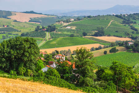 rural landscape with houses standing alone in the province of Tuscany in Italy