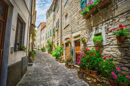 ITALY - JUNE 23, 2014: Typical Italian street in a small provincial town of Tuscan, Italy, Europeのeditorial素材