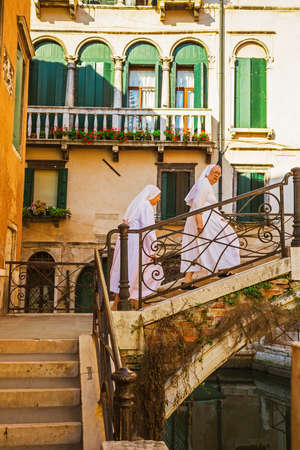 VENICE-JUNE, 26, 2014: Narrow canal among old colorful brick houses in Venice, Italy.のeditorial素材