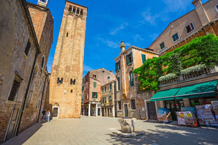 VENICE-JUNE, 26, 2014: Narrow canal among old colorful brick houses in Venice, Italy.のeditorial素材