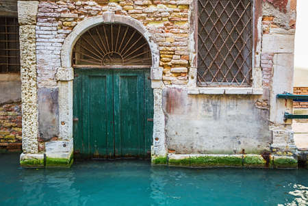 Wooden Ancient Italian Door in Historic Centerの写真素材