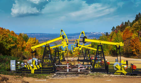 Oil Pump on a background of forest in Russiaのeditorial素材