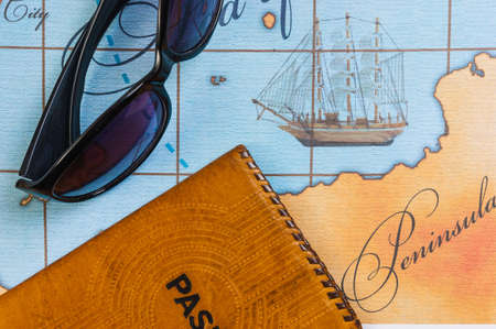 Still life with things leisure and travel on a background of mapの写真素材