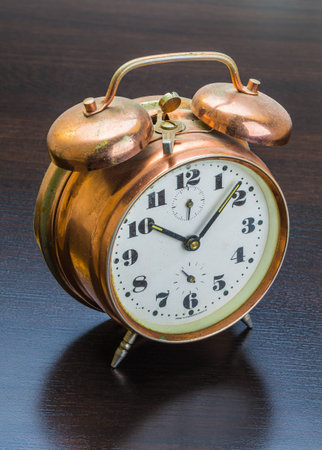 Vintage watch on a wooden boardの写真素材