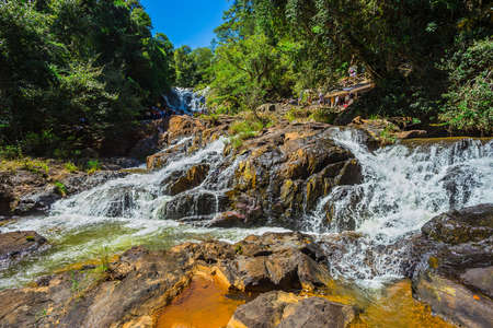 DALAT, VIETNAM - JUNE 14, 2014: Unidentified tourists pose and take pictures in front of Datanla waterfall. It is located 5 km away from the city center.のeditorial素材