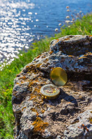 Orientation Concept - Compass Abandoned on the Rocksの写真素材