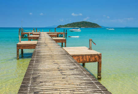 Old wooden jetty on exotic beach island, Thailandのeditorial素材