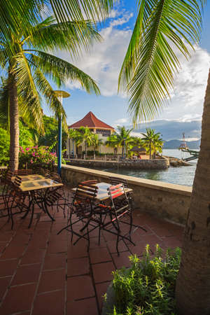 Cafe with tables on a background of the sea in Vietnamの写真素材
