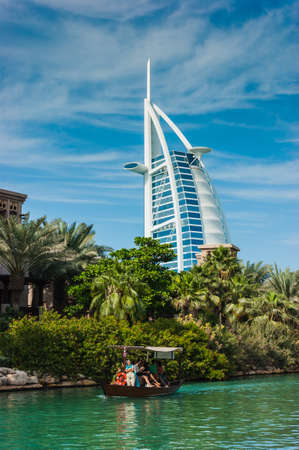 DUBAI, UAE - NOVEMBER 15: View of the hotel Burj Al Arab from Souk Madinat Jumeirah. Nov 15, 2012 in Dubai. Burj Al Arab is a luxury 7 stars hotel built  in front of Jumeirah beach.のeditorial素材