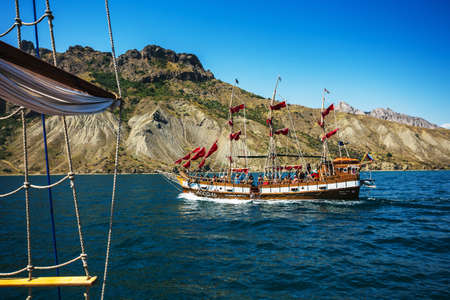 Crimea, Koktebel, Jul 31, 2014. Old ship with sails, sailing in the seaのeditorial素材