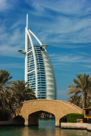 DUBAI, UAE - NOVEMBER 15: View of the hotel Burj Al Arab from Souk Madinat Jumeirah. Nov 15, 2012 in Dubai. Burj Al Arab is a luxury 7 stars hotel built  in front of Jumeirah beach.のeditorial素材