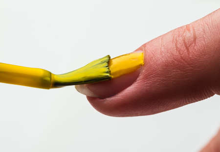 The Painting female fingernails with nail polish