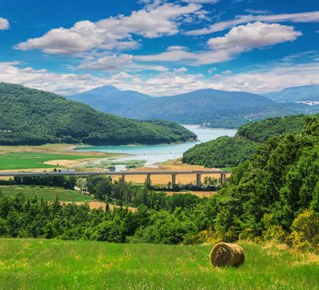 rural landscape with houses standing alone in the province of Tuscany in Italyの写真素材