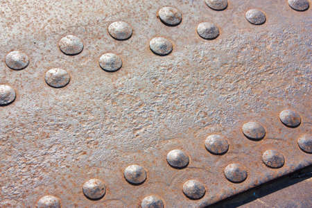 background of the rivets on rusty metalsの写真素材