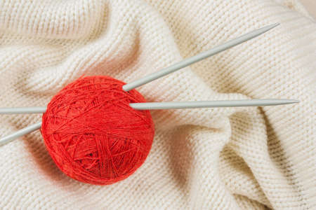 Balls with thread and needles for knitting