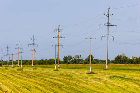 High voltage wires power transmission lines in the field