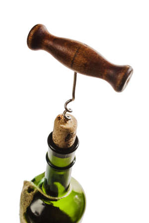 bottle of wine with a corkscrew isolated on white backgroundの写真素材