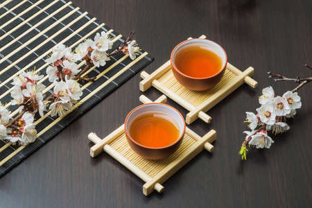 Ancient Chinese tea set with spring flowersの写真素材