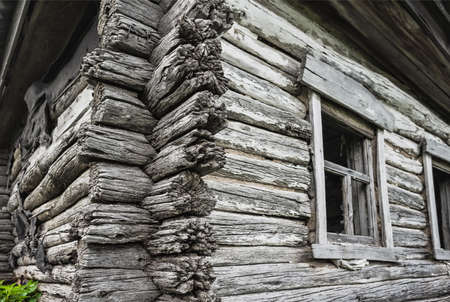 Dilapidated old wooden rustic house in Russiaの写真素材