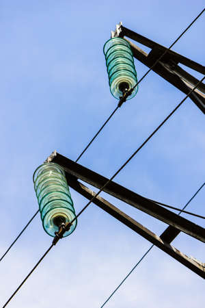 High voltage wires power transmission lines in the fieldの写真素材