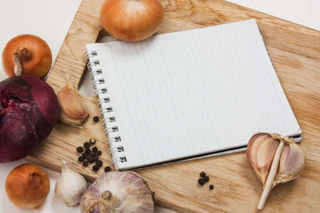 notebook for culinary notes on a cutting board