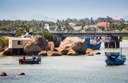 Nha Trang, Vietnam, NOV, 11, 2014. Boats and rocks near fishing village on the river Kai in Nha Trangのeditorial素材