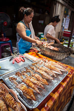 Thailand, April 3, 2015. Grilled squids in the market of Koh Chang, Thailandのeditorial素材