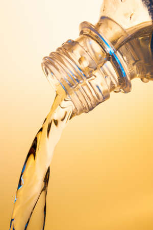 stream of water flows from the bottleの写真素材