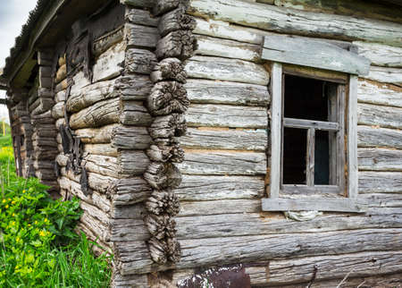Dilapidated old wooden rustic house in Russiaの写真素材