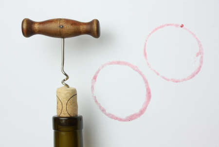 corkscrew and cork on a white background