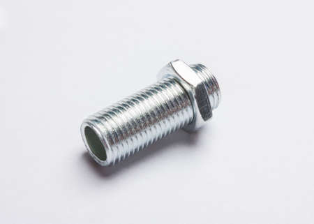 bolts and nuts are scattered on the background