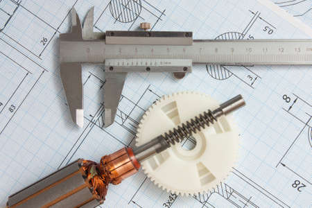 electrical components and stationery measuring tools against drawingsの写真素材