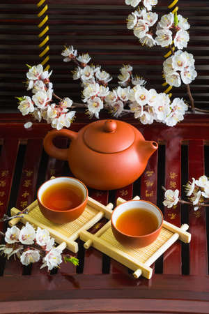 Ancient Chinese tea set with spring flowersの写真素材