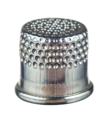 silver thimble for sewing isolated on white backgroundの写真素材