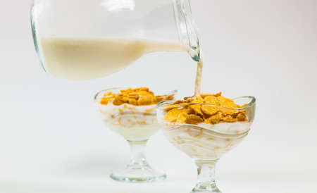 cornflakes and jug of milkの写真素材