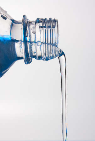 stream of water flows from the bottleの写真素材