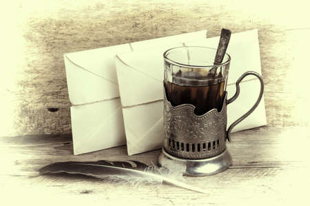 Postage on the background of an old wooden boardの写真素材