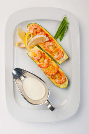 Zucchini with shrimp and sauce on white backgroundの写真素材