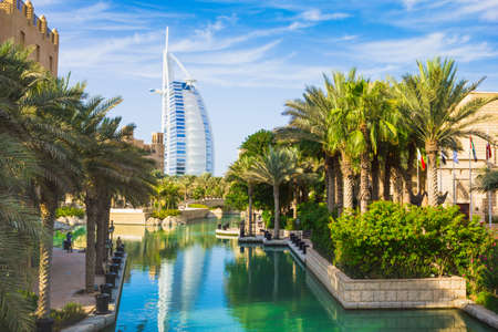 DUBAI, UAE - NOVEMBER 15: View of the hotel Burj Al Arab from Souk Madinat Jumeirah. Nov 15, 2012 in Dubai. Burj Al Arab is a luxury 7 stars hotel built  in front of Jumeirah beach.のeditorial素材