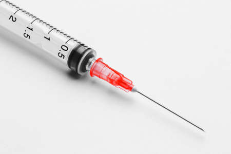Disposable syringe in the row on white background.の写真素材