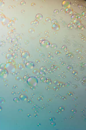 The soap bubbles on a colored backgroundの写真素材