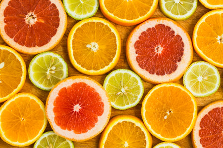 Citrus fruit background with sliced f oranges lemons lime tangerines and grapefruit as a symbol of healthy eating and immune system boost with natural vitamins.の写真素材